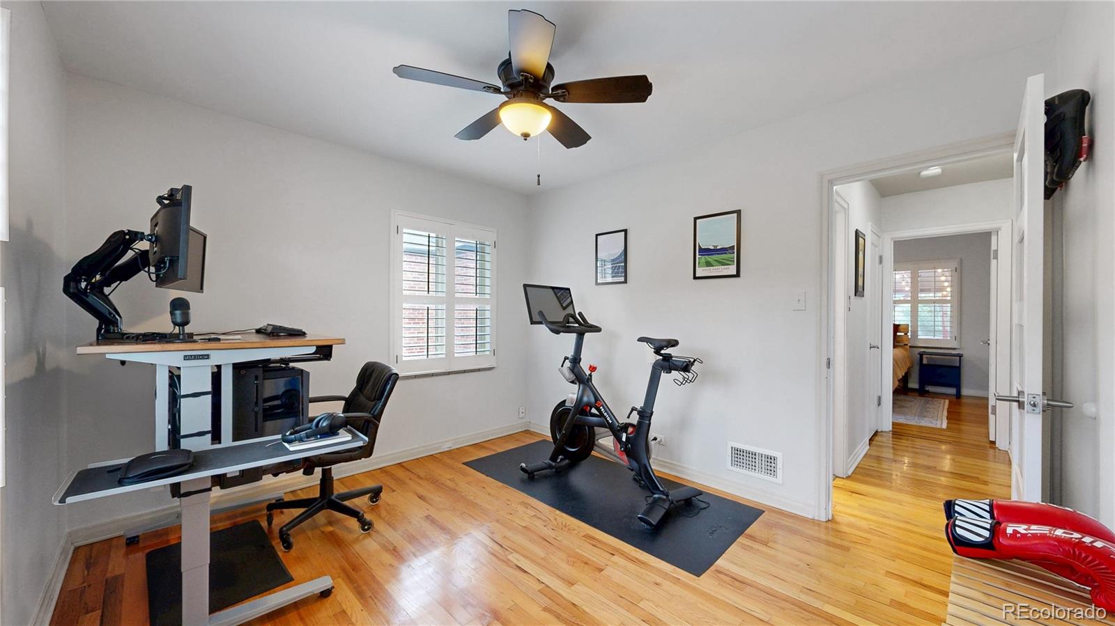 940 Grape Street Denver, CO 80220 - Photo 19 of 50 a view of a workspace with furniture and a gym machine