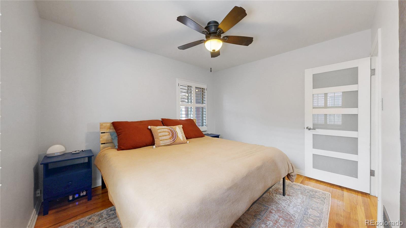 940 Grape Street Denver, CO 80220 - Photo 22 of 50 a bedroom with a bed and a window