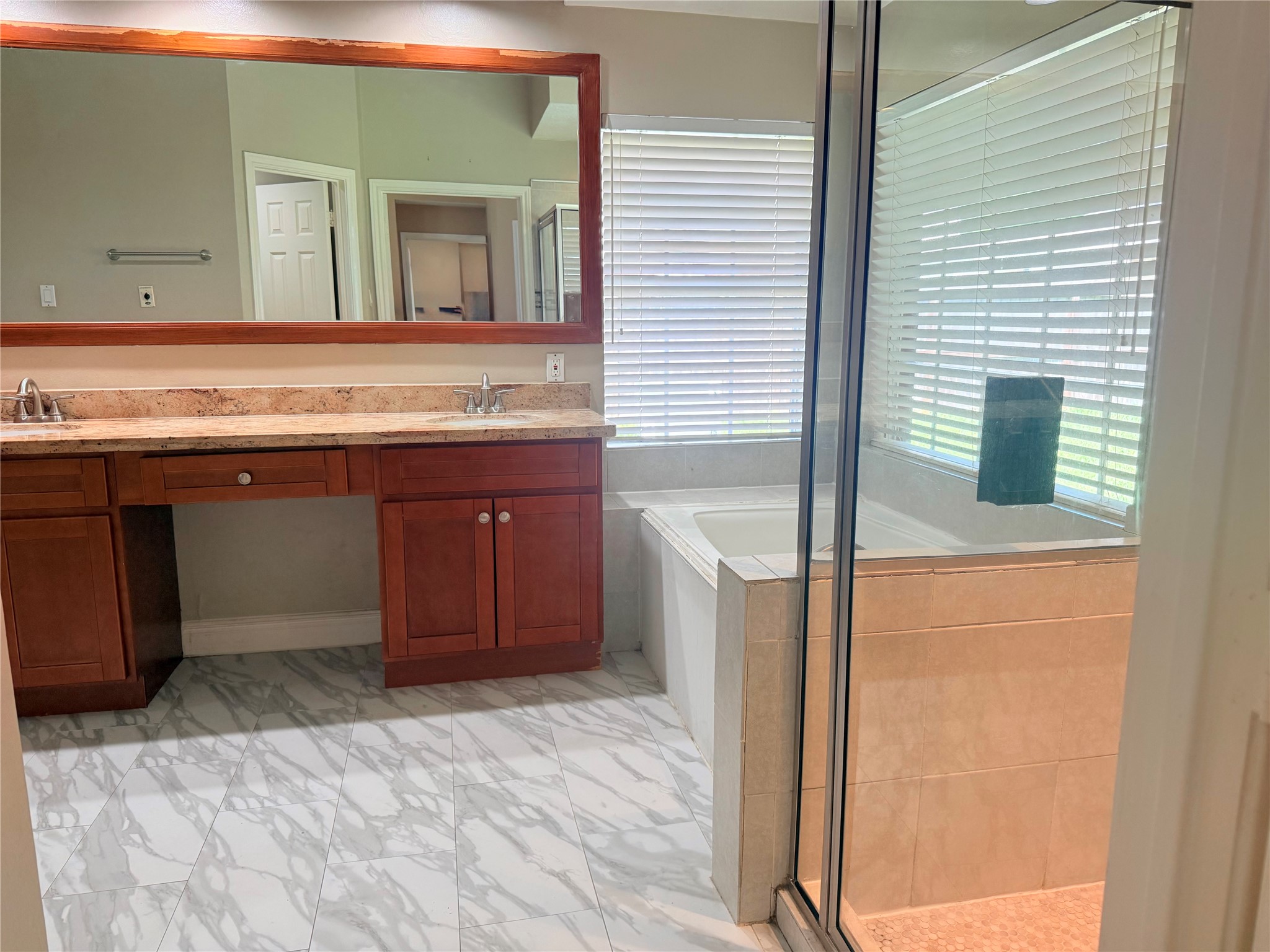 5010 Rebel Ridge Drive Sugar Land, TX 77478 - Photo 12 of 23 a bathroom with a sink and a mirror