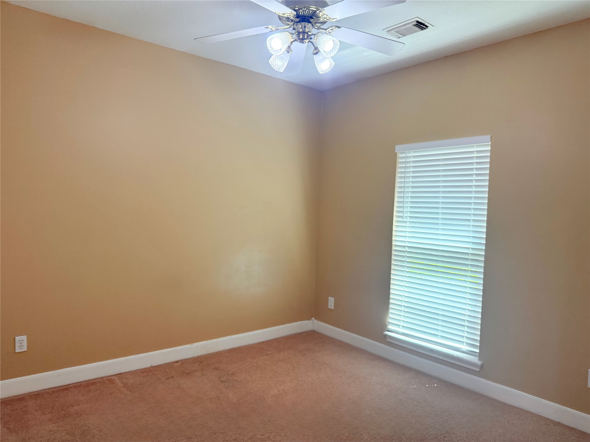 5010 Rebel Ridge Drive Sugar Land, TX 77478 - Photo 14 of 23 an empty room with a window and a fan