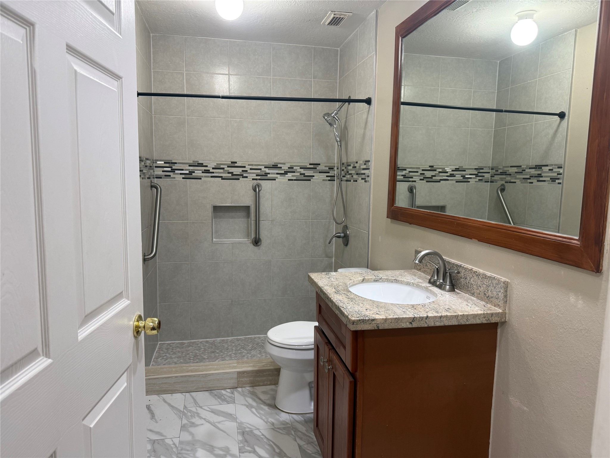 5010 Rebel Ridge Drive Sugar Land, TX 77478 - Photo 16 of 23 a bathroom with a sink and a mirror