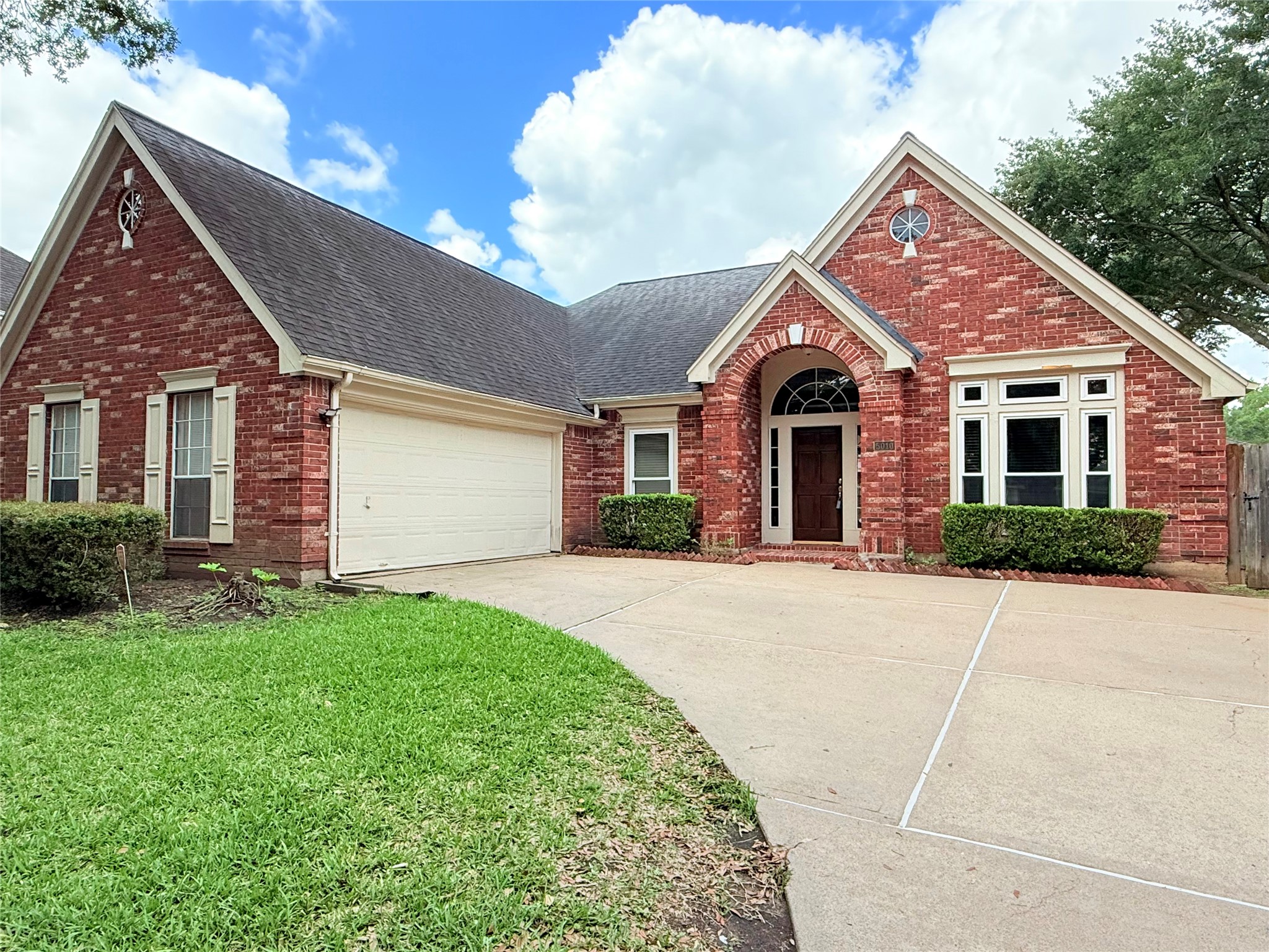 5010 Rebel Ridge Drive Sugar Land, TX 77478 - Photo 2 of 23 a front view of a house with garden