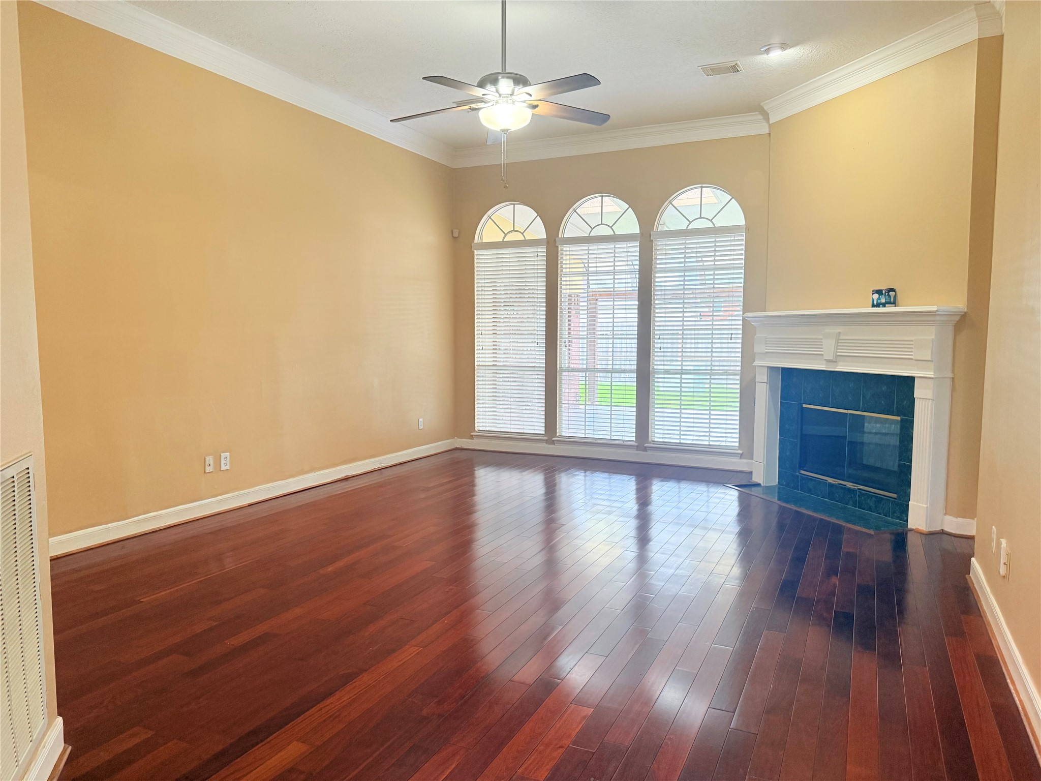 5010 Rebel Ridge Drive Sugar Land, TX 77478 - Photo 7 of 23 wooden floor in an empty room with a fireplace