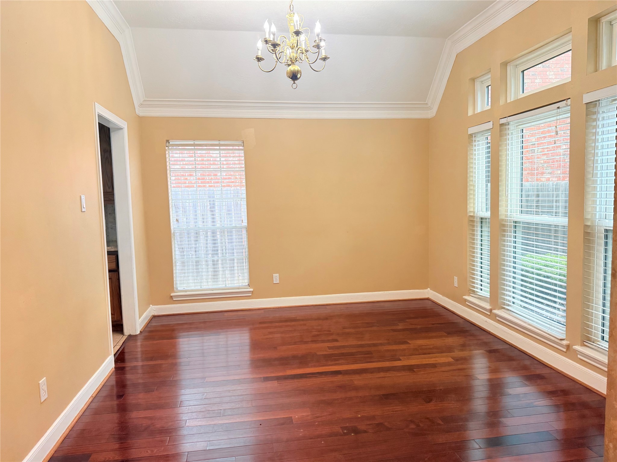 5010 Rebel Ridge Drive Sugar Land, TX 77478 - Photo 9 of 23 a view of an empty room with wooden floor and a window