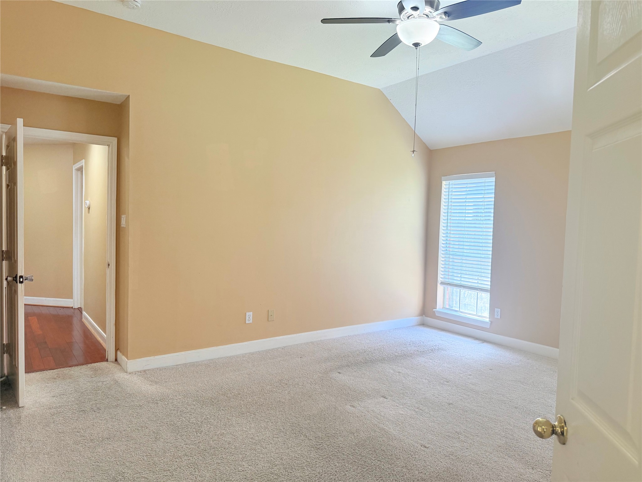5010 Rebel Ridge Drive Sugar Land, TX 77478 - Photo 10 of 23 an empty room with a chandelier fan and windows
