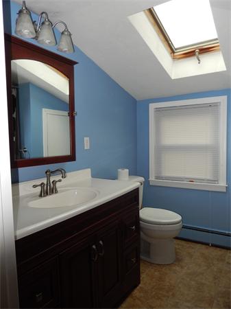 75 Chesbrough Road Boston, MA 02132 - Photo 11 of 16 a bathroom with a toilet sink and mirror
