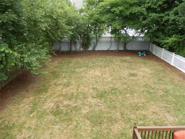 75 Chesbrough Road Boston, MA 02132 - Photo 14 of 16 a view of an outdoor space and a yard