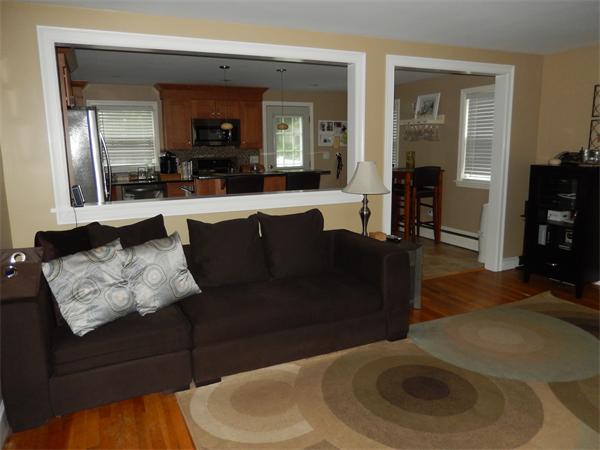 75 Chesbrough Road Boston, MA 02132 - Photo 3 of 16 a living room with furniture and a wooden floor