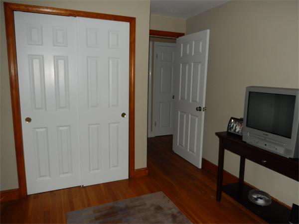 75 Chesbrough Road Boston, MA 02132 - Photo 6 of 16 a view of a livingroom with furniture and wooden floor