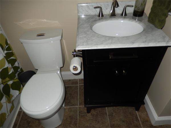 75 Chesbrough Road Boston, MA 02132 - Photo 7 of 16 a bathroom with a sink and a mirror