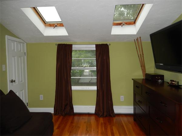 75 Chesbrough Road Boston, MA 02132 - Photo 9 of 16 a room with wooden floor and a window