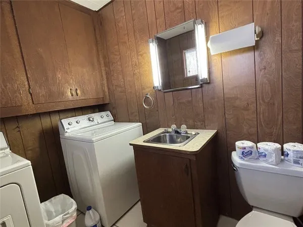 a bedroom with a bed and a mirror