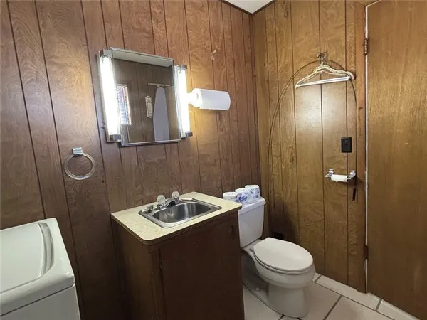a bedroom with a bed and a mirror