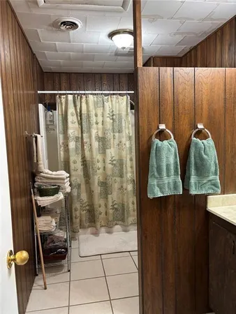 a view of walk in closet with clothes