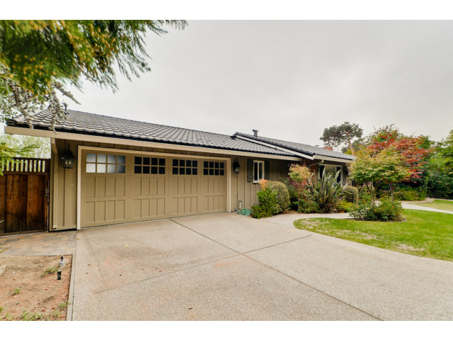 1606 Courtland Road Belmont, CA 94002 - Photo 2 of 17 a front view of a house with a garden