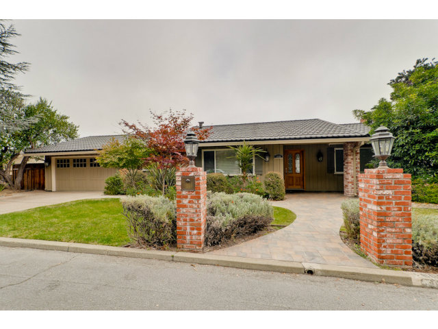 1606 Courtland Road Belmont, CA 94002 - Photo 3 of 17 a front view of a house with garden
