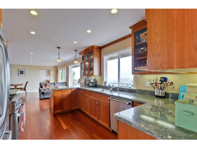 1606 Courtland Road Belmont, CA 94002 - Photo 7 of 17 a kitchen with lots of counter top space and living room