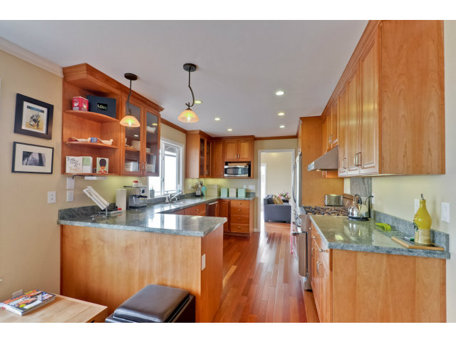 1606 Courtland Road Belmont, CA 94002 - Photo 8 of 17 a kitchen with stainless steel appliances granite countertop a refrigerator a sink dishwasher a stove and a wooden cabinets