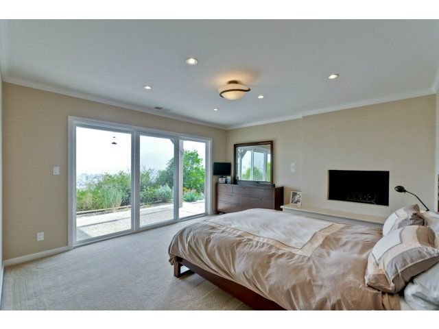 1606 Courtland Road Belmont, CA 94002 - Photo 9 of 17 a bedroom with a large bed and a large window