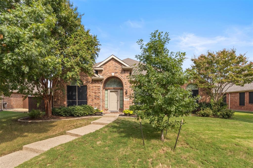 12334 Blue Ridge Drive Frisco, TX 75033 - Photo 2 of 20 a front view of a house with a yard