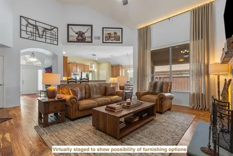 a living room with furniture and a window