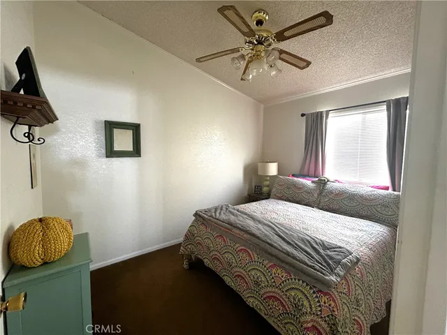 a bedroom with a bed and dresser