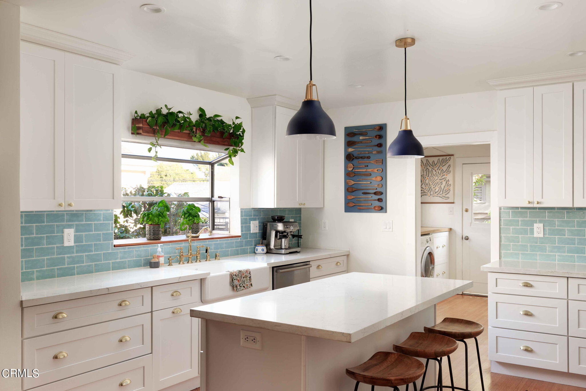 1864 Queensberry Road Pasadena, CA 91104 - Photo 16 of 40 a kitchen with a stove a sink a center island and windows