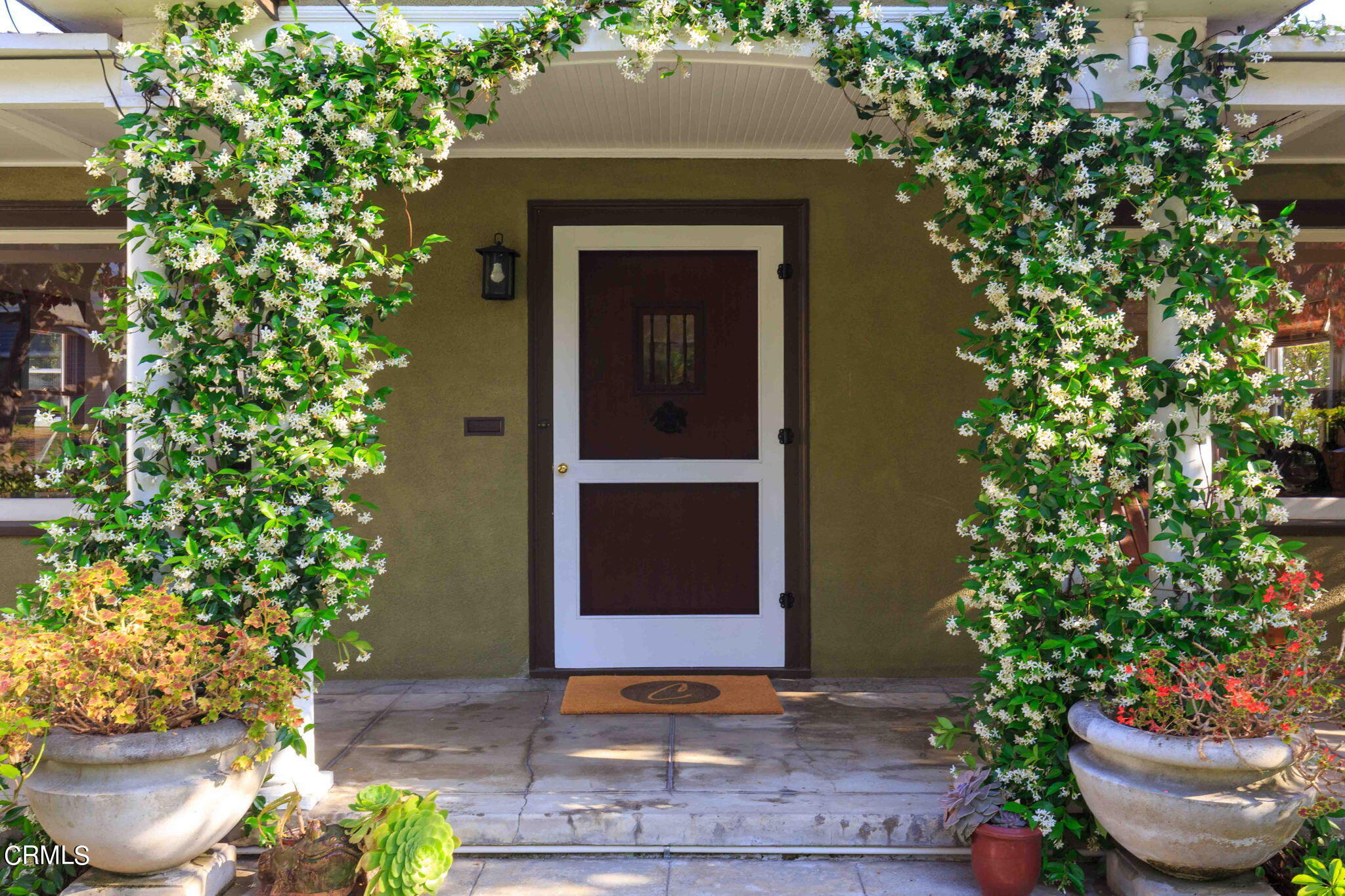 1864 Queensberry Road Pasadena, CA 91104 - Photo 2 of 40 a front view of a house with a yard