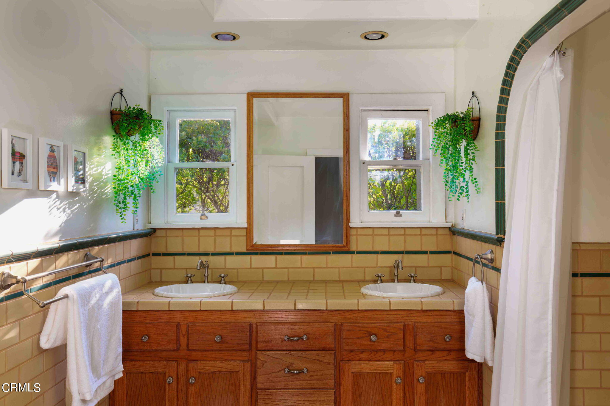 1864 Queensberry Road Pasadena, CA 91104 - Photo 30 of 40 a bathroom with a granite countertop sink a mirror and next to a window