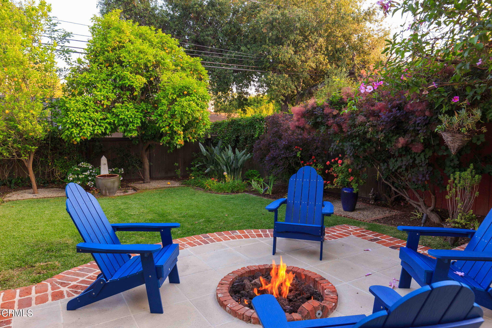 1864 Queensberry Road Pasadena, CA 91104 - Photo 33 of 40 a view of a backyard with table and chairs and a fire pit