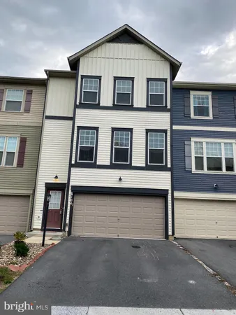 a view of a house with large windows