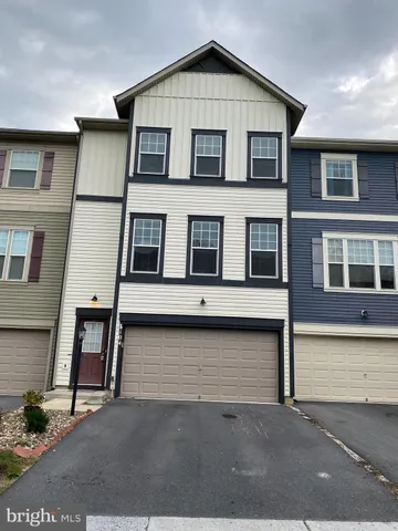 a view of a house with large windows