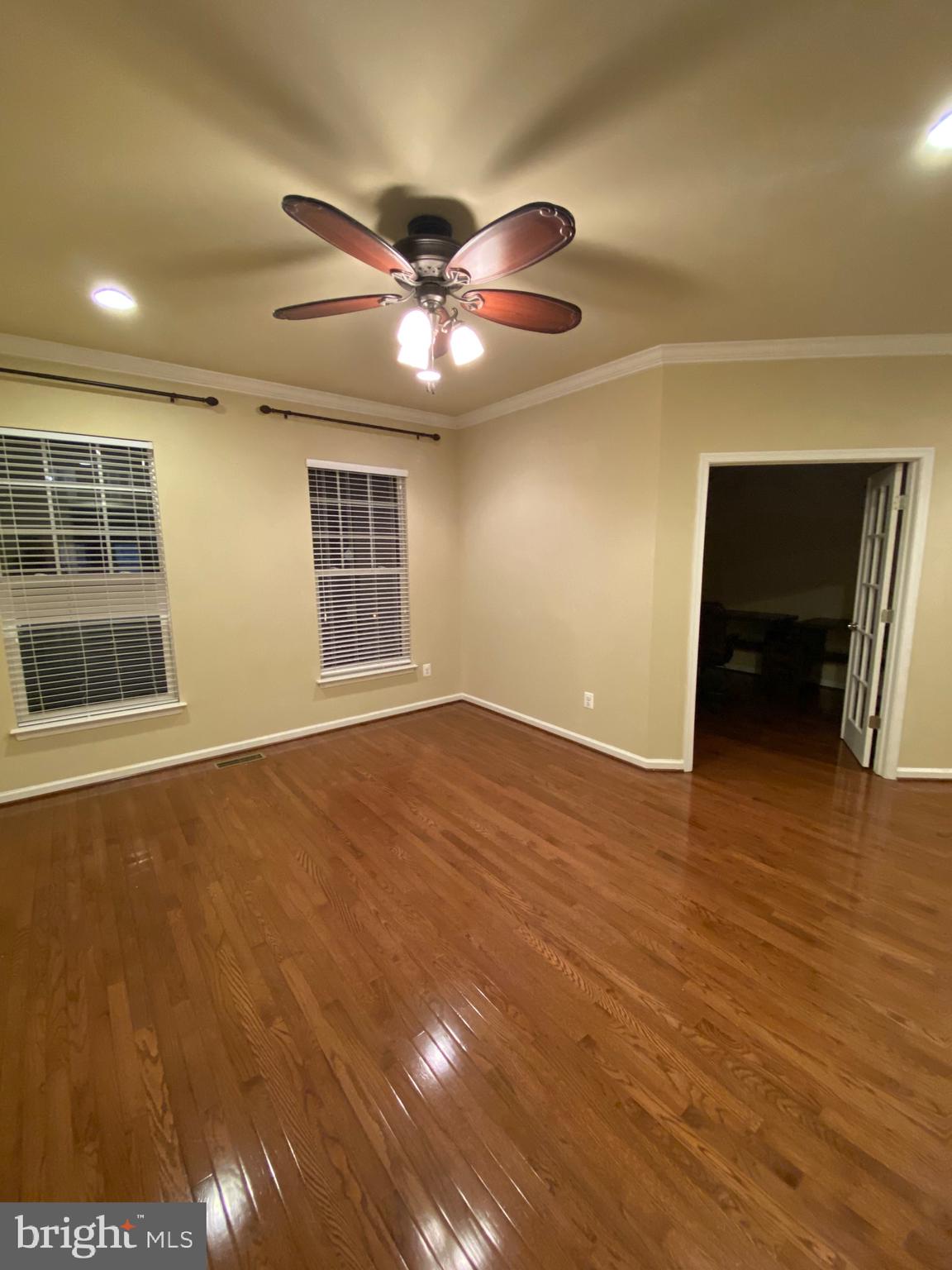 104 Gretchen Court Stephenson, VA 22656 - Photo 25 of 40 a view of an empty room with wooden floor and a window