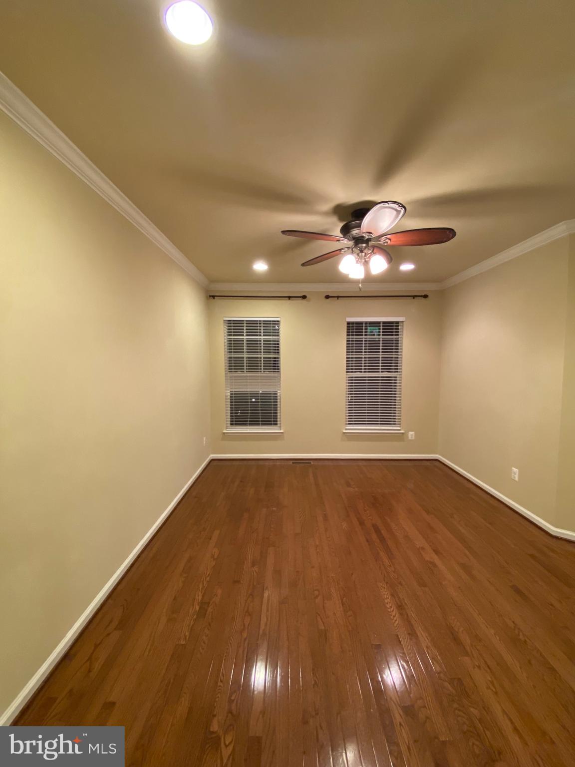 104 Gretchen Court Stephenson, VA 22656 - Photo 26 of 40 a view of an empty room with wooden floor and a window