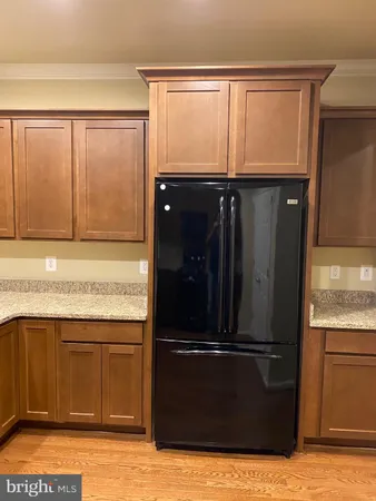 a kitchen with stainless steel appliances granite countertop a stove and a microwave