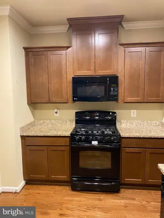 a kitchen with a refrigerator and a sink