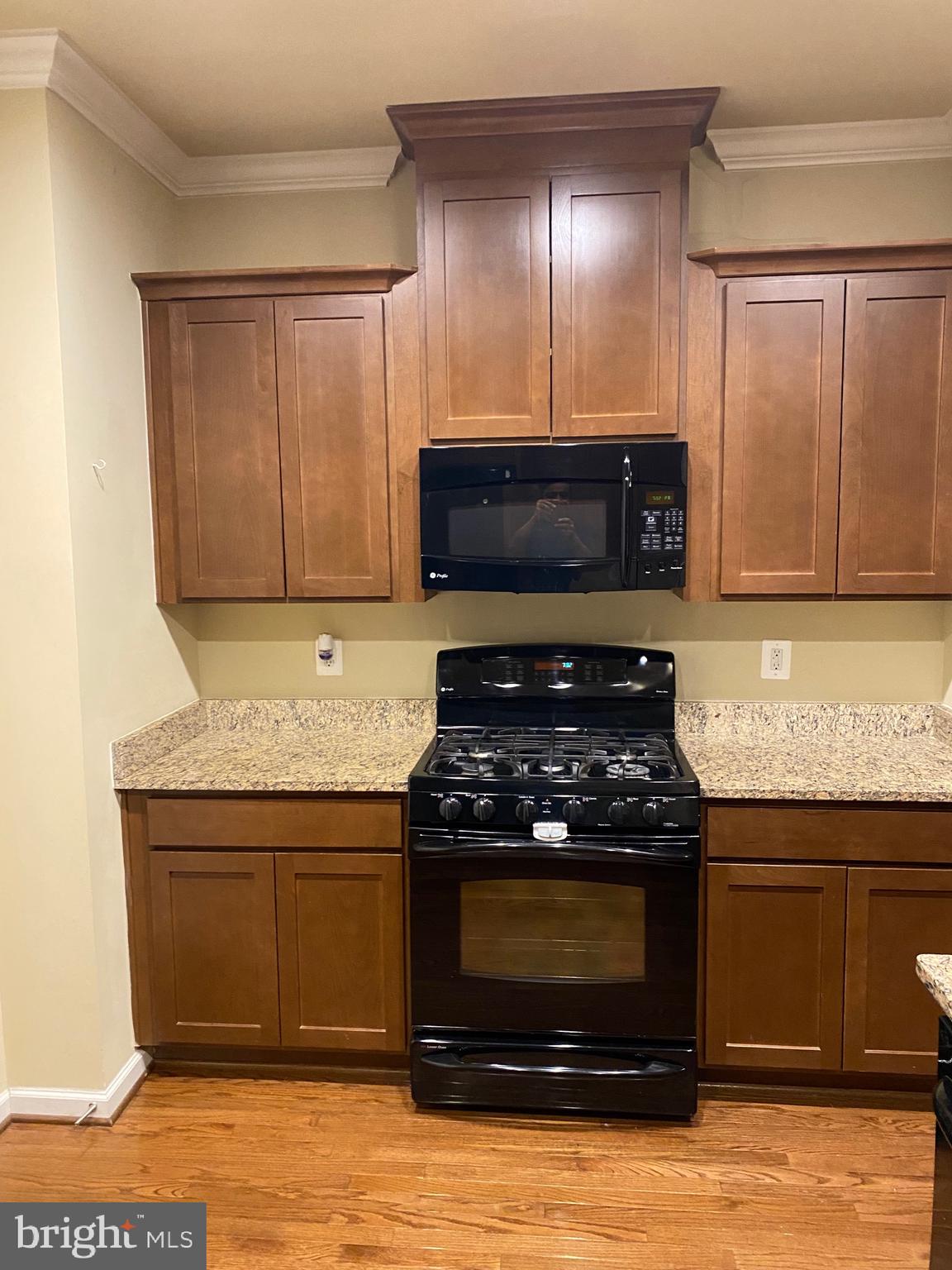 104 Gretchen Court Stephenson, VA 22656 - Photo 29 of 40 a kitchen with stainless steel appliances granite countertop a stove and a microwave