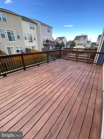 a view of a balcony with wooden floor