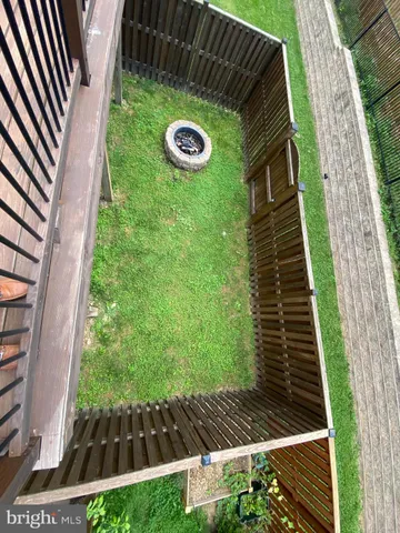 a view of a backyard with sitting area