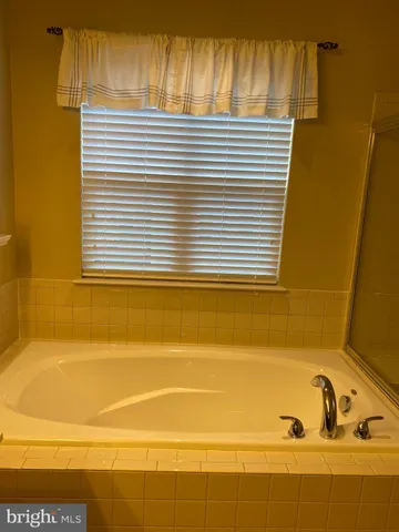 a view of a bathtub in a bathroom