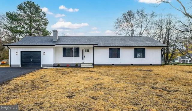 a house with trees in front of it