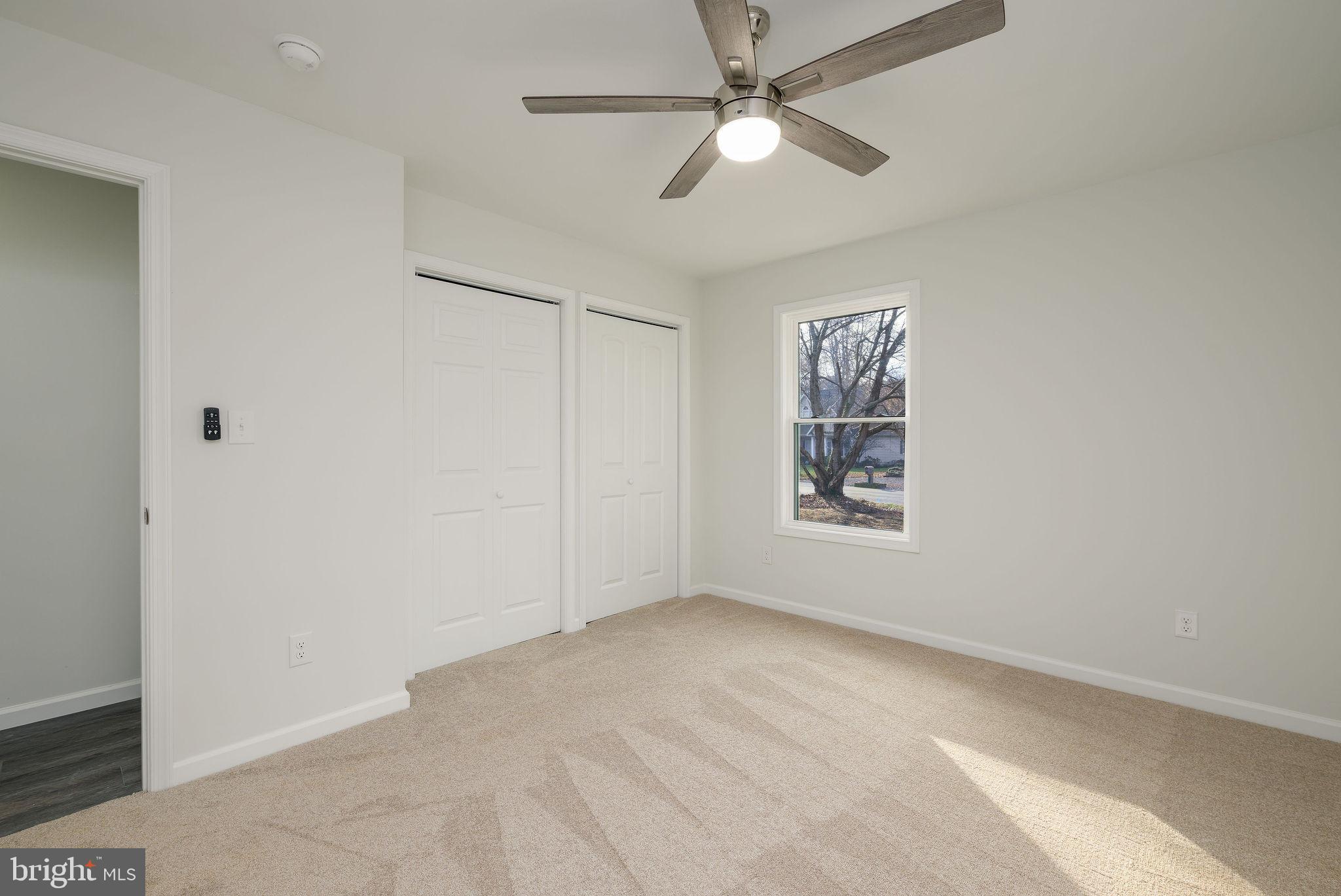 16853 Sherbrooke Road Lewes, DE 19958 - Photo 23 of 32 a view of an empty room with a window