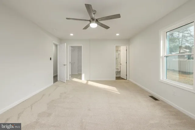 an aerial view of lake and residential houses with outdoor space