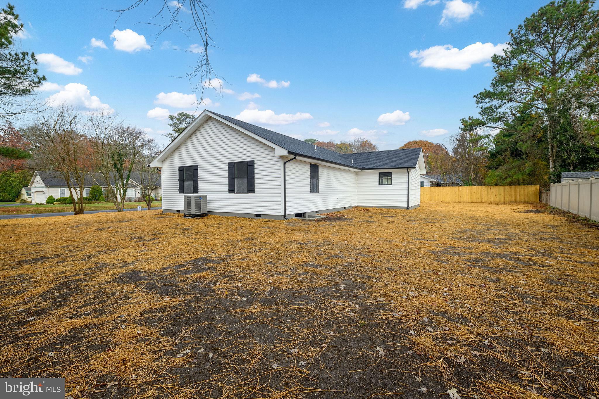 16853 Sherbrooke Road Lewes, DE 19958 - Photo 4 of 32 a view of a house with a yard