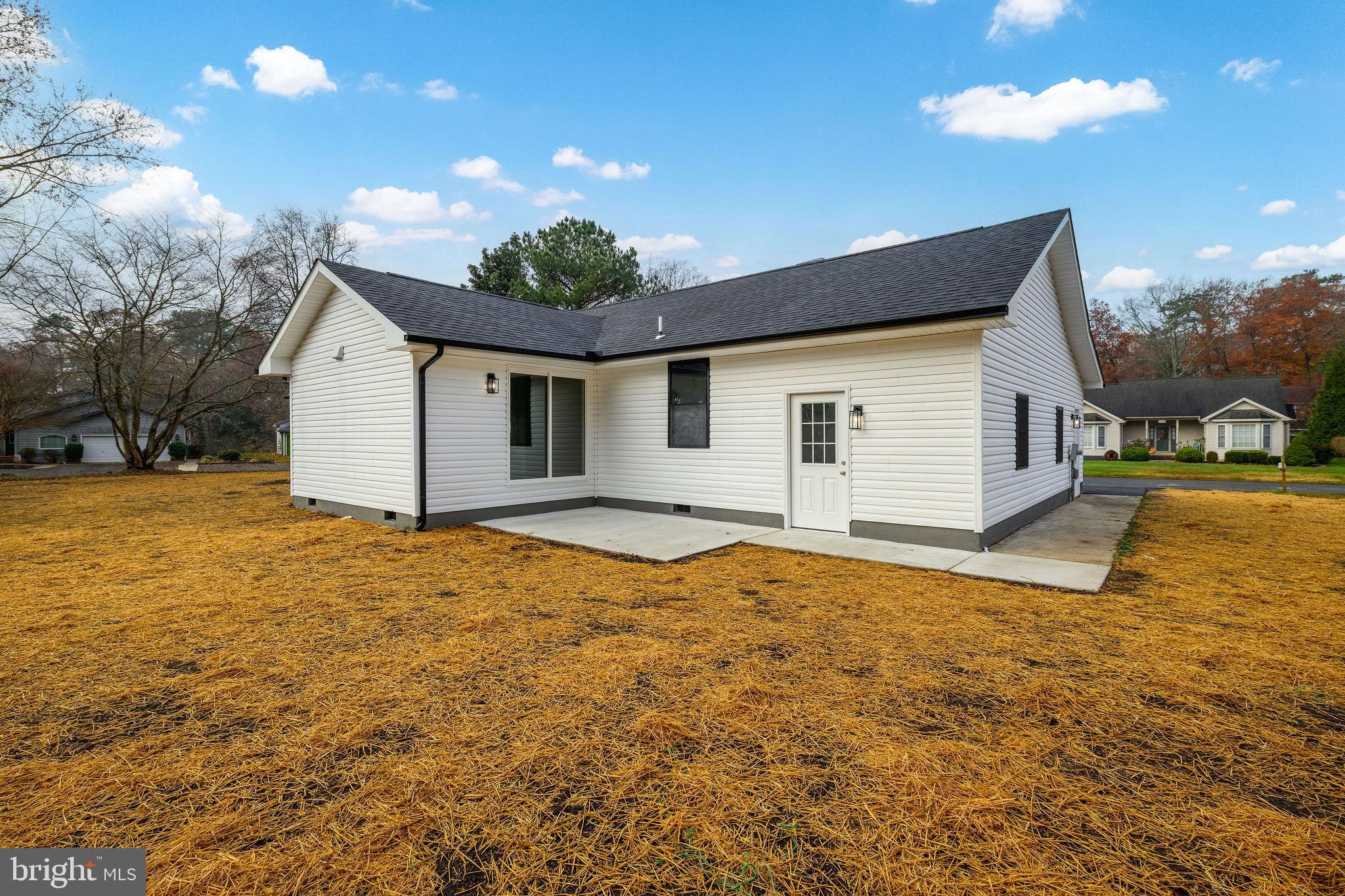 16853 Sherbrooke Road Lewes, DE 19958 - Photo 5 of 32 a view of a house with a yard