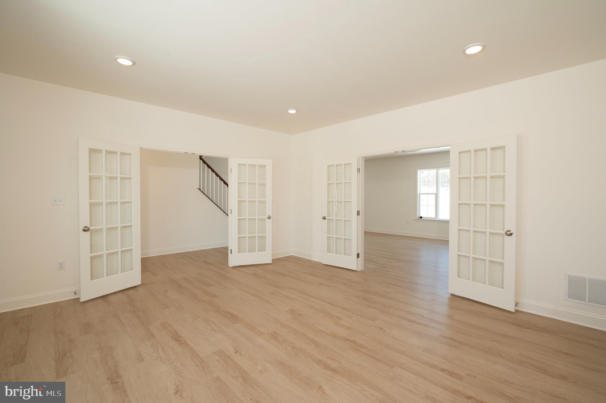 420 Royal Hunt Way Lititz, PA 17543 - Photo 8 of 19 an empty room with wooden floor and windows