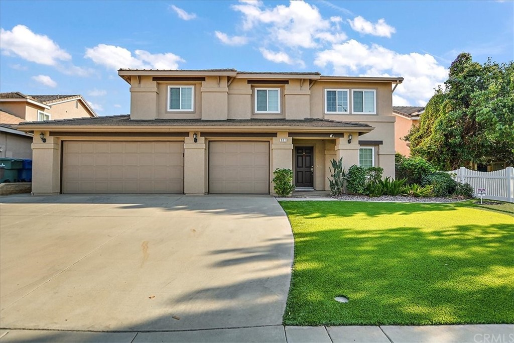 911 Saltcoats Drive Riverside, CA 92508 - Photo 1 of 1 a front view of a house with a yard and garage