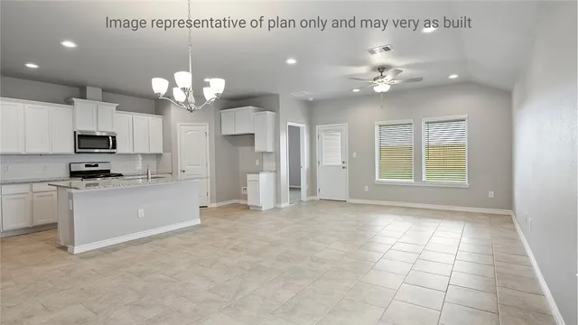 a view of a kitchen with a sink cabinets and stainless steel appliances