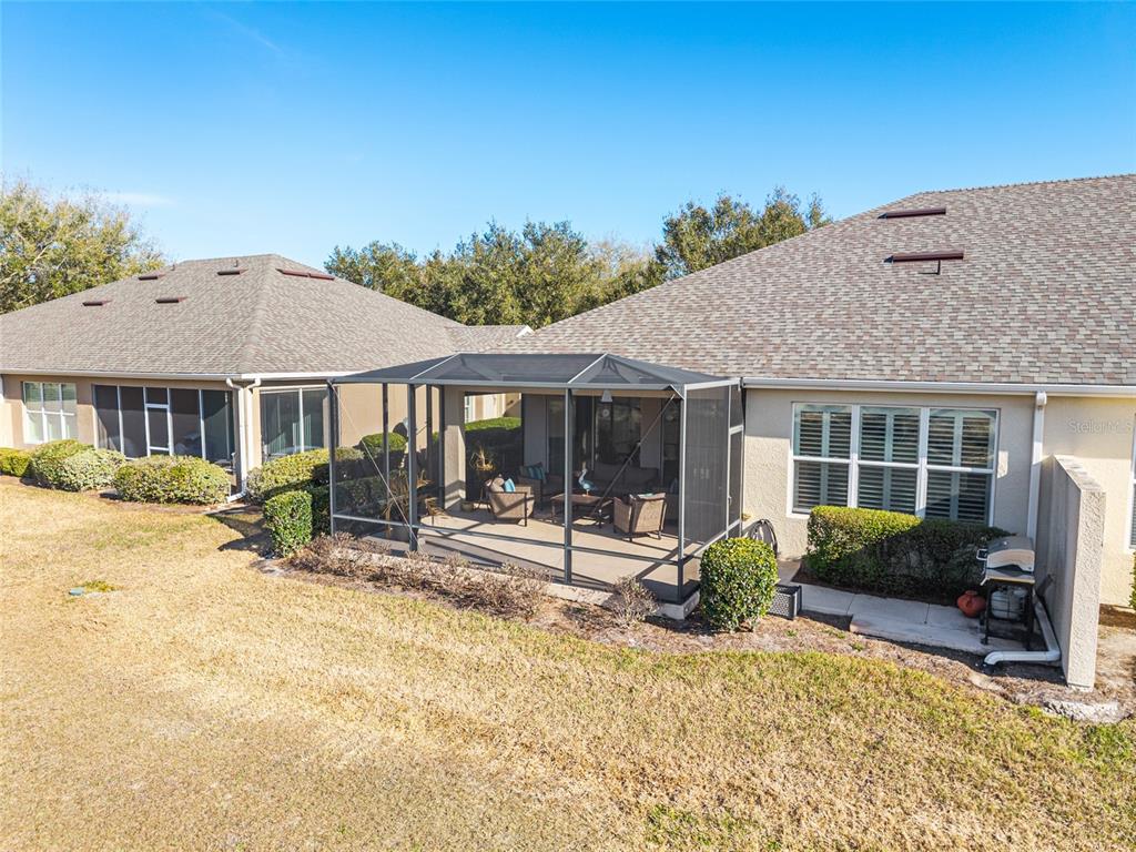 9595 Southwest 70th Loop Ocala, FL 34481 - Photo 14 of 100 a view of a house with a patio