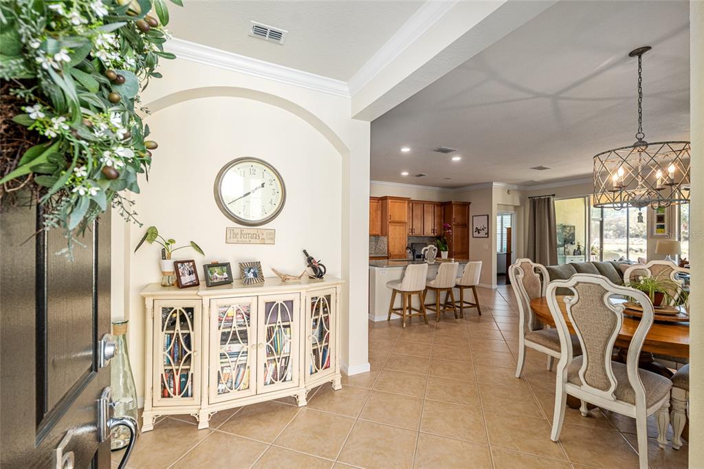 9595 Southwest 70th Loop Ocala, FL 34481 - Photo 18 of 100 a dining room with furniture entryway and wooden floor